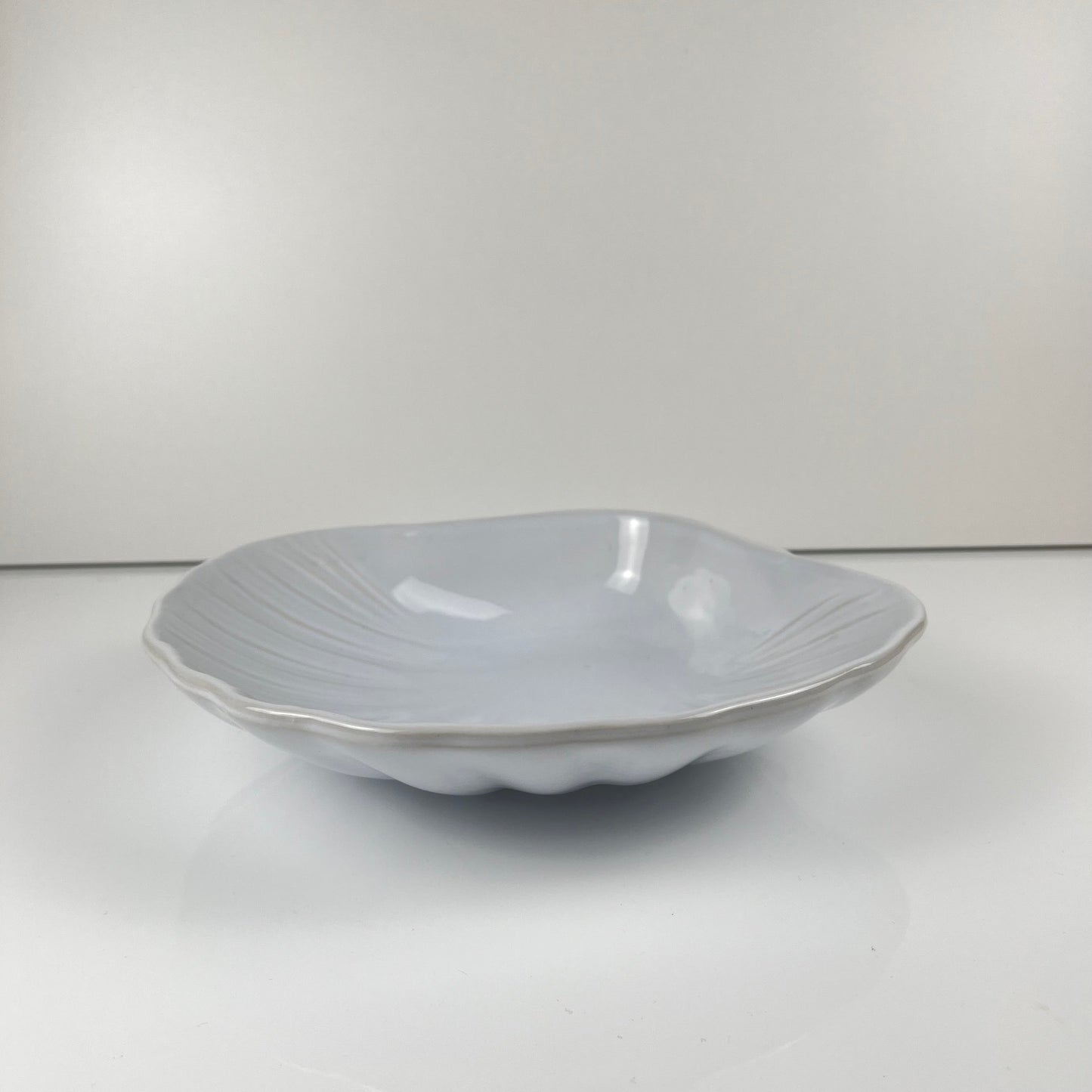 Large platter in the shape of a scallop shell, Emile Henry, France, mid-20th century