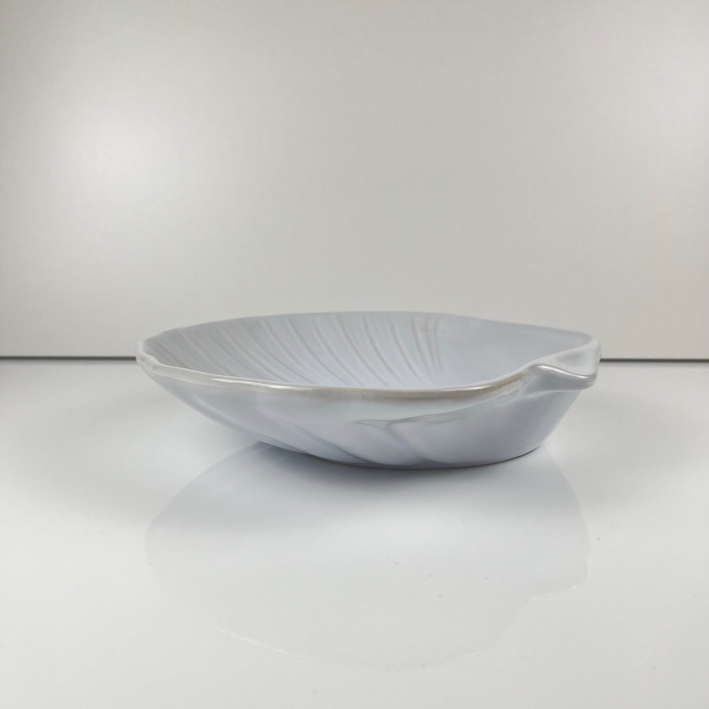 Large platter in the shape of a scallop shell, Emile Henry, France, mid-20th century