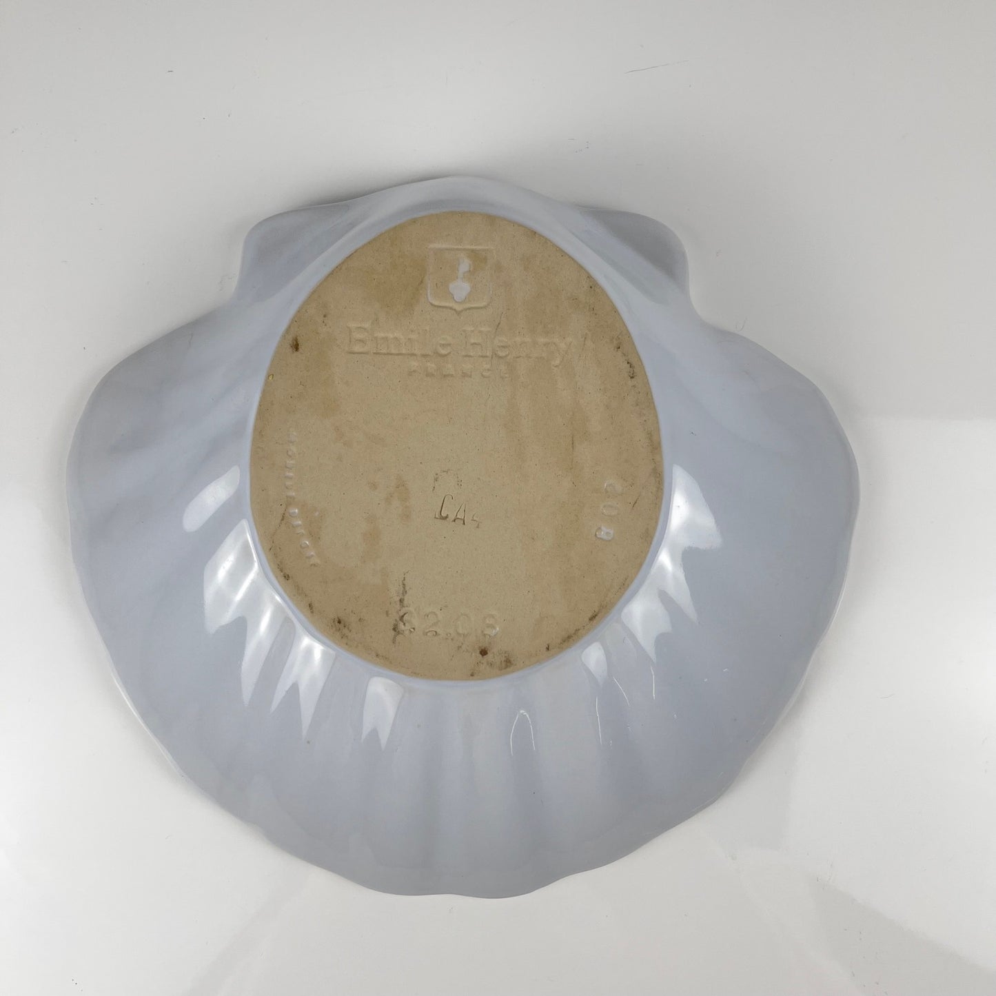 Large platter in the shape of a scallop shell, Emile Henry, France, mid-20th century