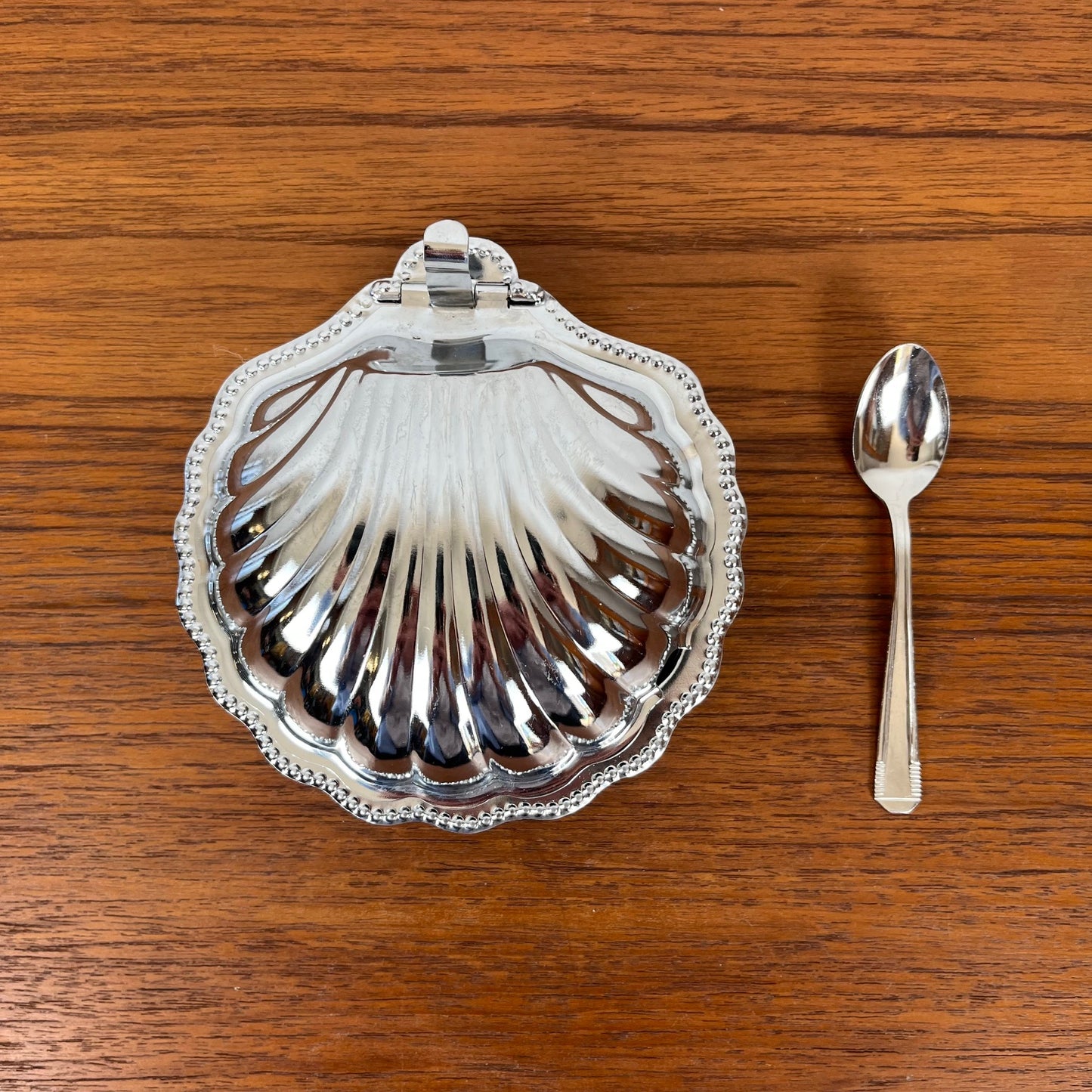 Silver-plated metal shell butter dish with blue insert, 1970