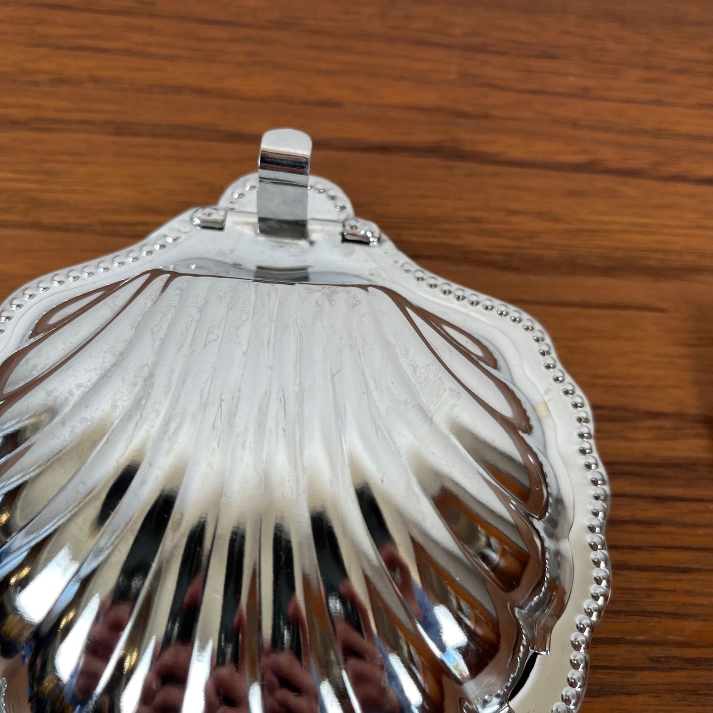 Silver-plated metal shell butter dish with blue insert, 1970