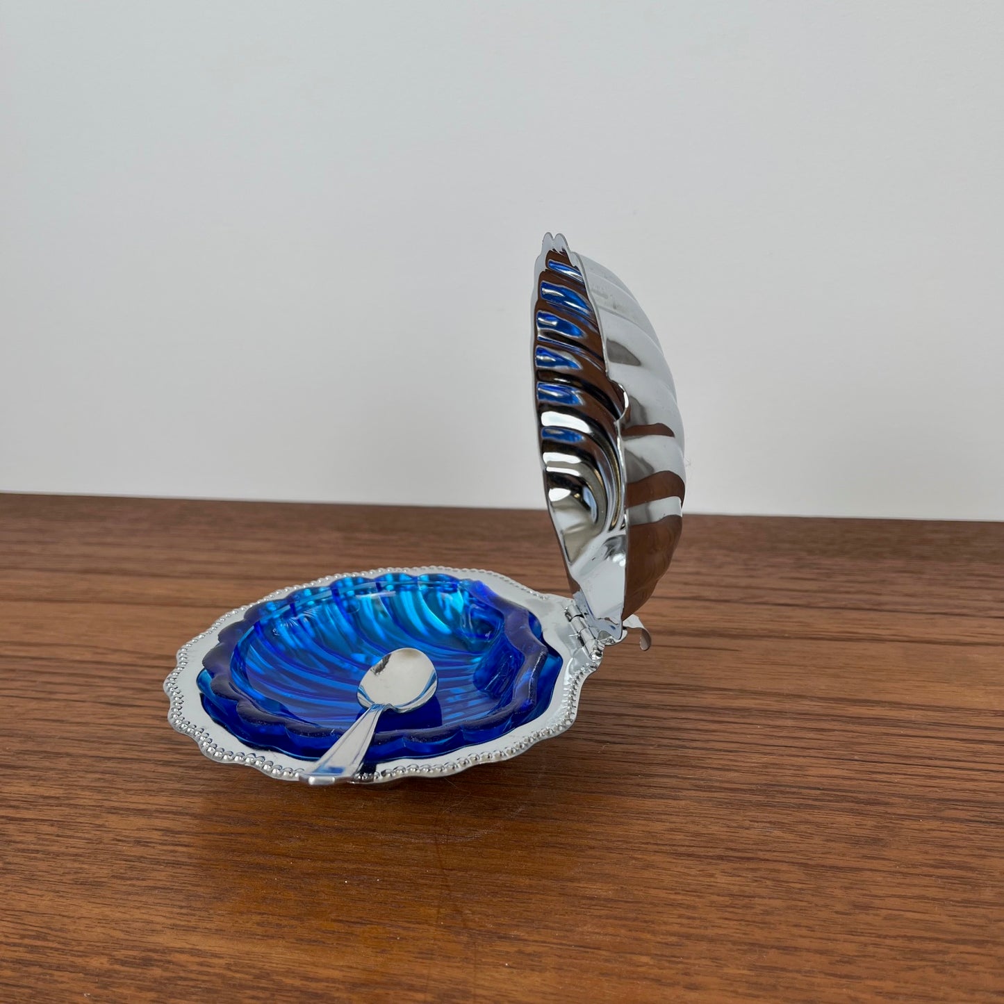 Silver-plated metal shell butter dish with blue insert, 1970