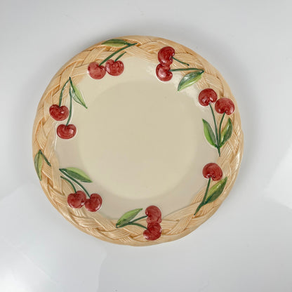 Antique earthenware dish with cherry pattern, signed "FG", 20th century