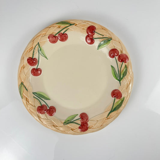 Plat ancien en barbotine motif cerise , signé "FG", XXe