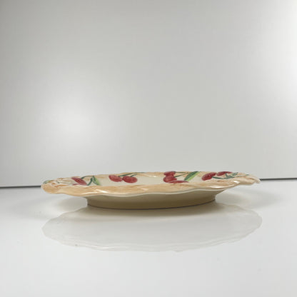 Antique earthenware dish with cherry pattern, signed "FG", 20th century