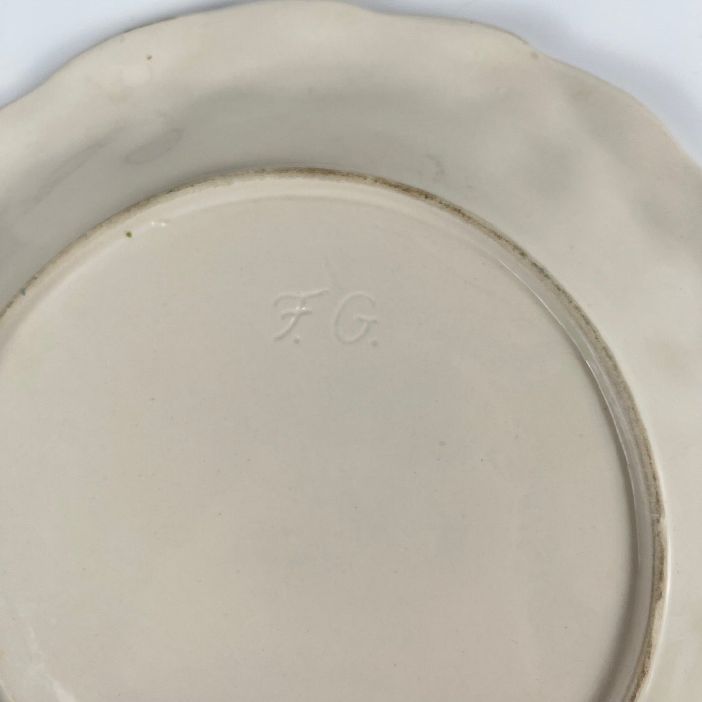 Antique earthenware dish with cherry pattern, signed "FG", 20th century