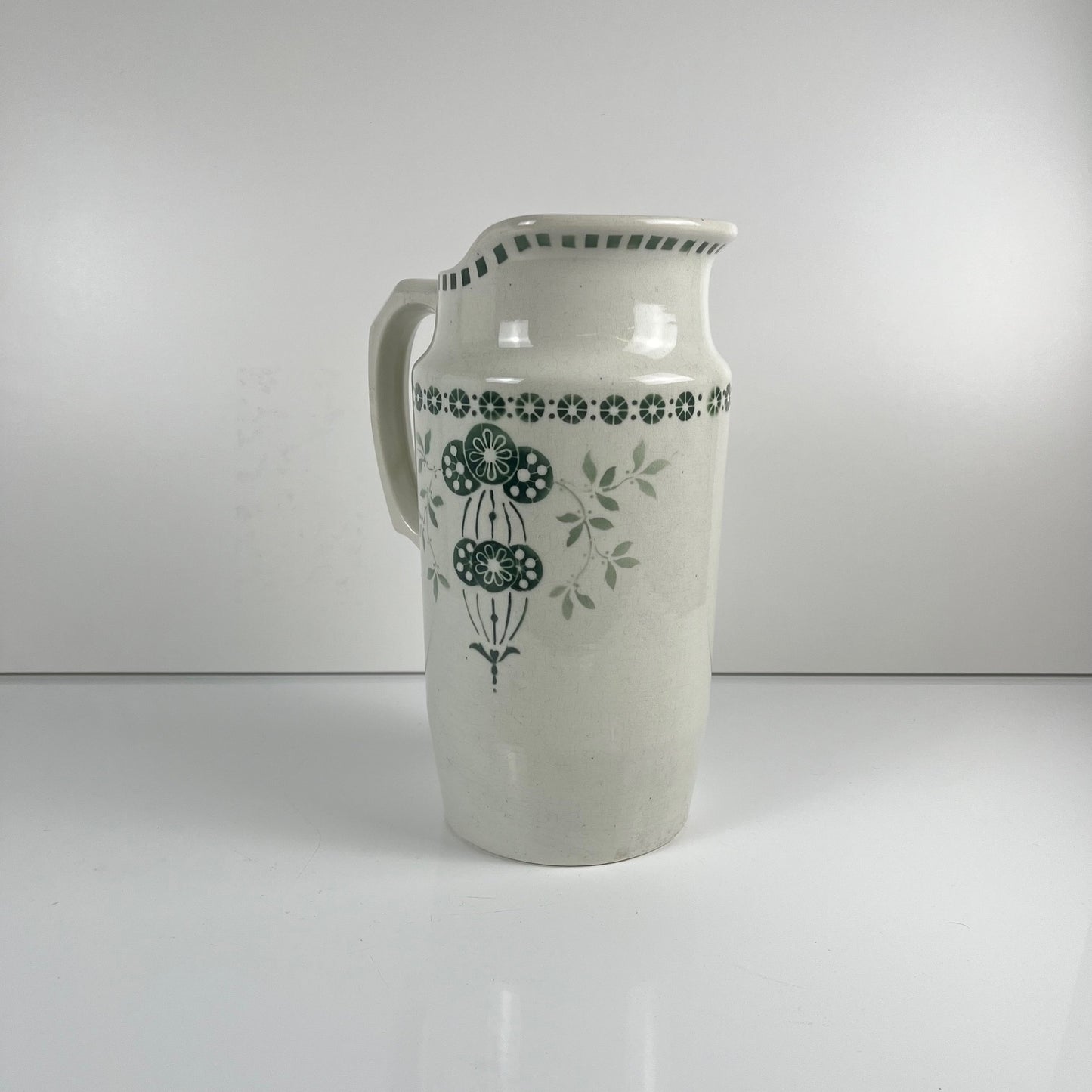 Antique earthenware pitcher, green floral decor, ironstone late 19th - early 20th century