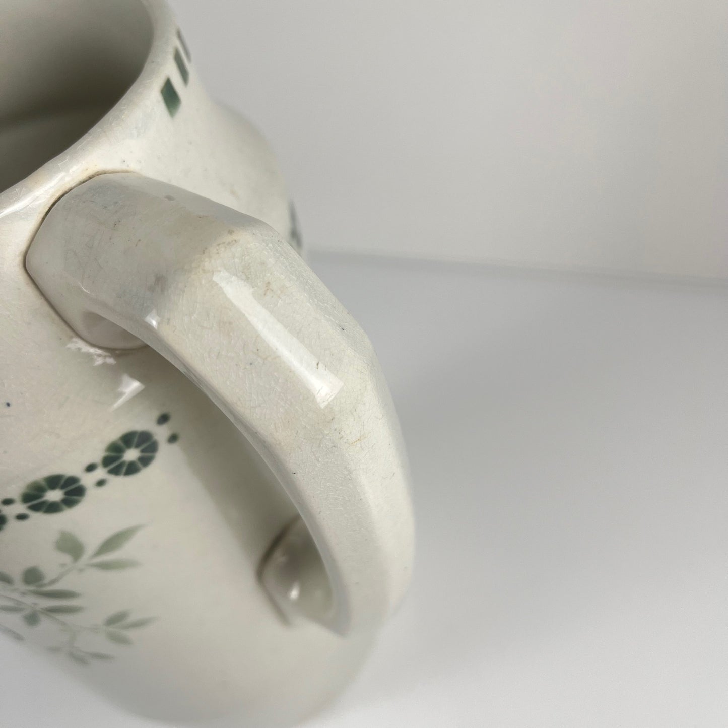 Antique earthenware pitcher, green floral decor, ironstone late 19th - early 20th century