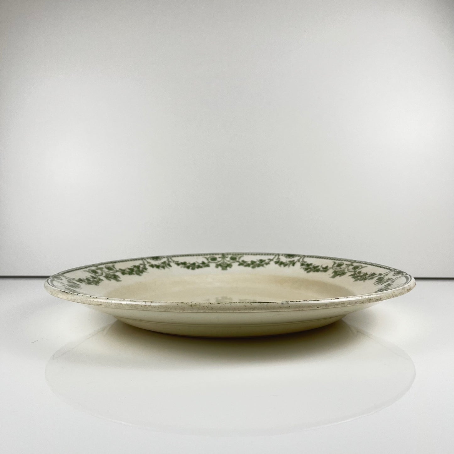 Plat rond "Champagne", Badonviller, vert, début XXème s.