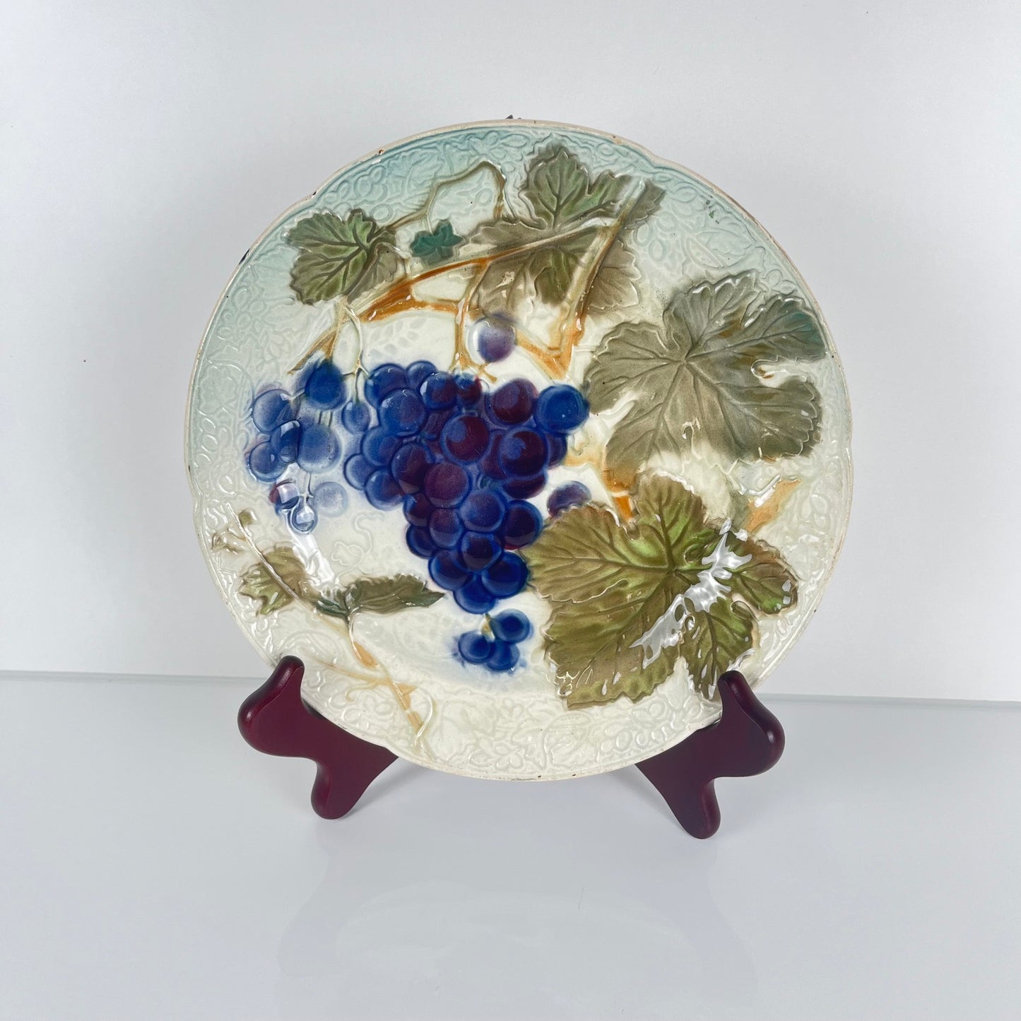 Set of 4 KG St Clément barbotine fruit plates (cherry, mirabelle plum, grape, pear), late 19th-early 20th century
