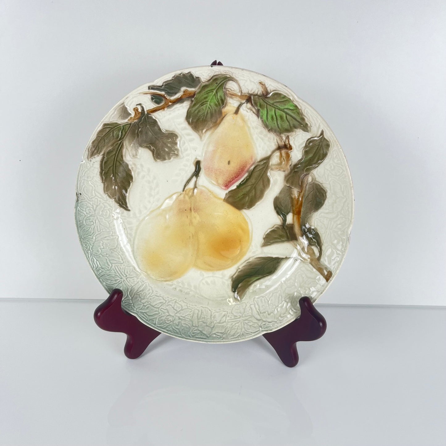 Set of 4 KG St Clément barbotine fruit plates (cherry, mirabelle plum, grape, pear), late 19th-early 20th century