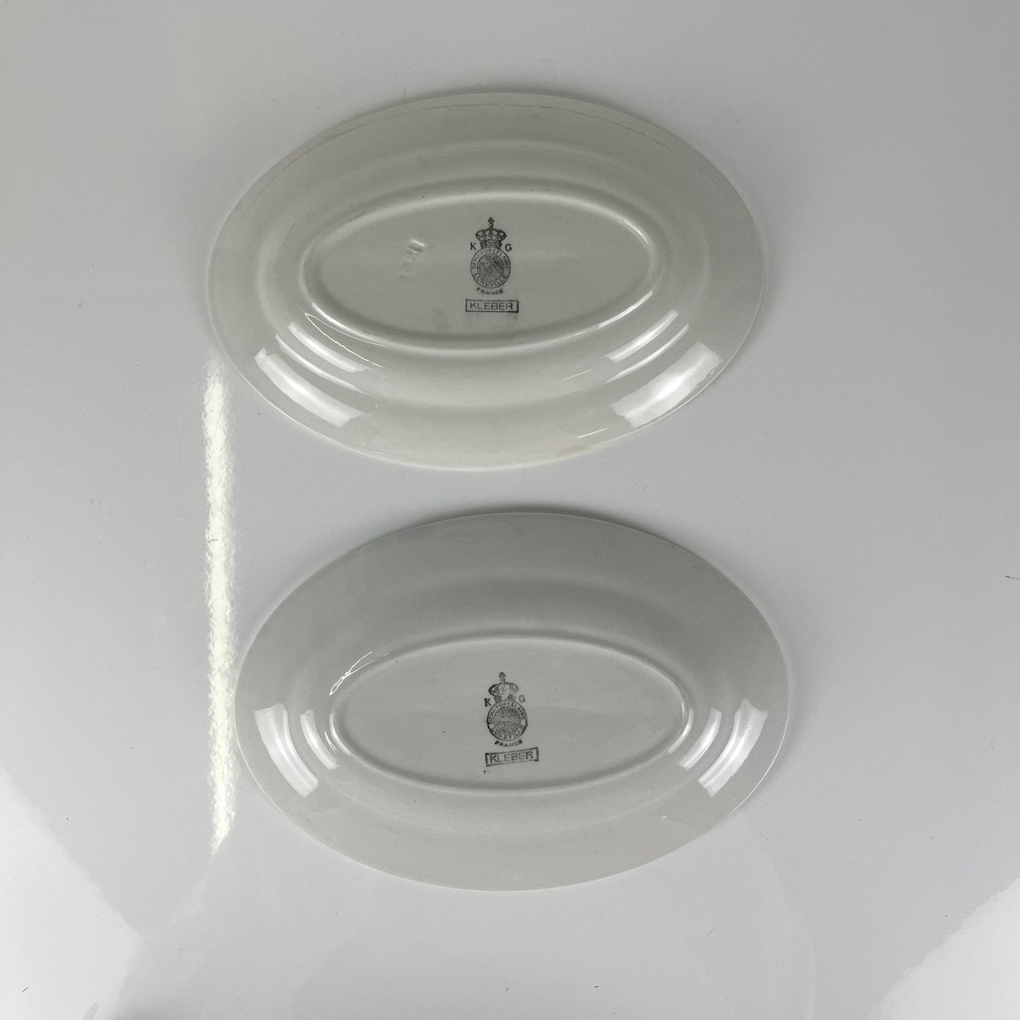 Pair of Ravier KG Lunéville plates, "Kleber" model, mid-20th century
