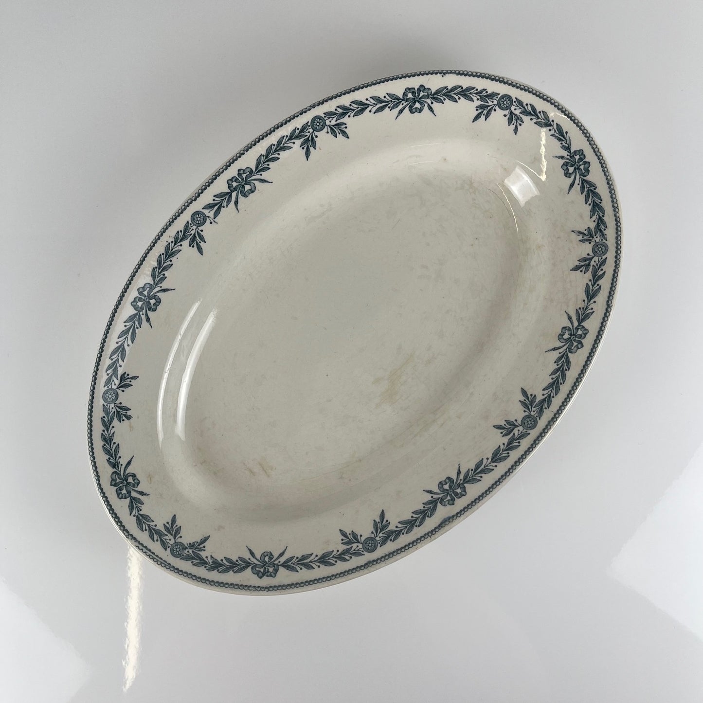 Large ironstone oval dish, "Lauriers" pattern by Moulins des loups - Hamage, 1900