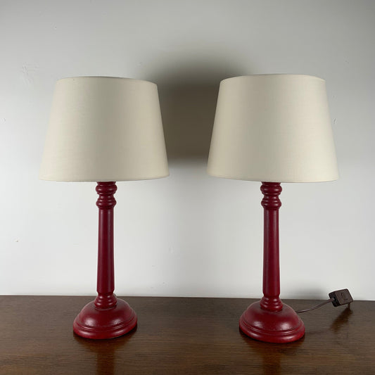 Duo of burgundy-colored wooden bedside lamps