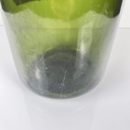Large antique apothecary bottle in green blown glass