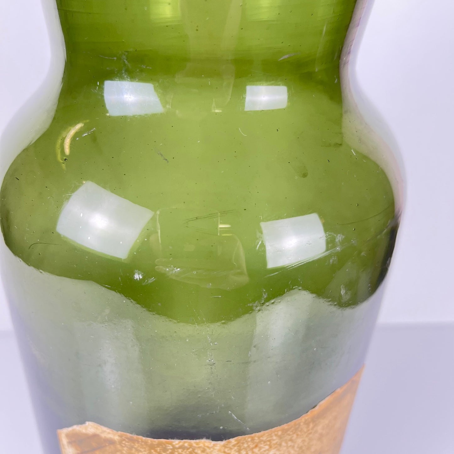 Large antique apothecary bottle in green blown glass