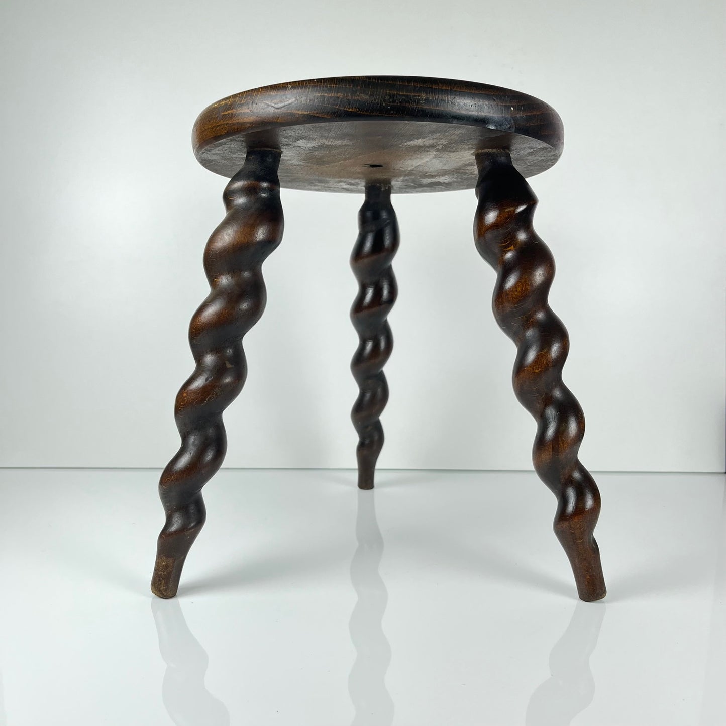 Antique solid wood stool with twisted legs, early 20th century
