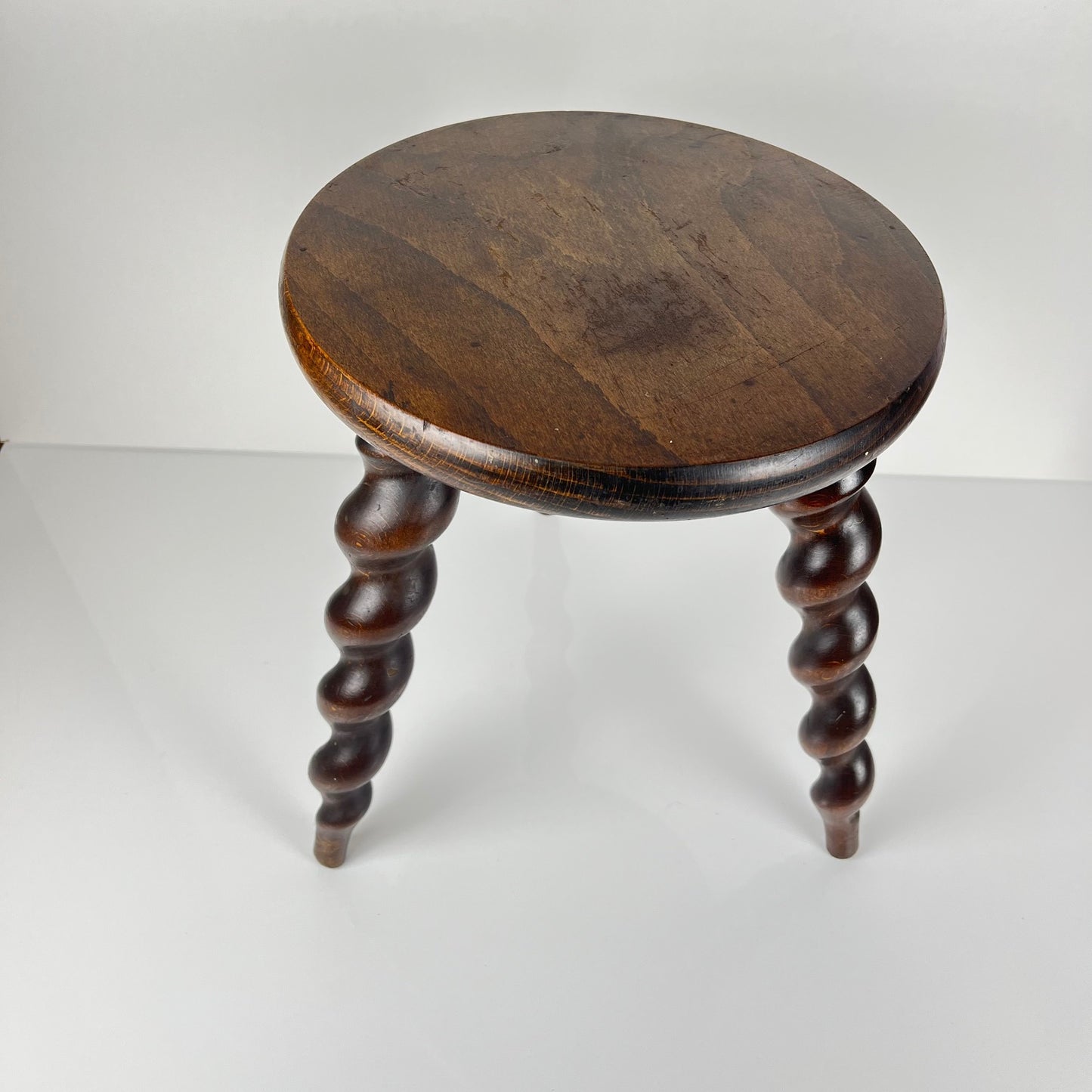 Antique solid wood stool with twisted legs, early 20th century