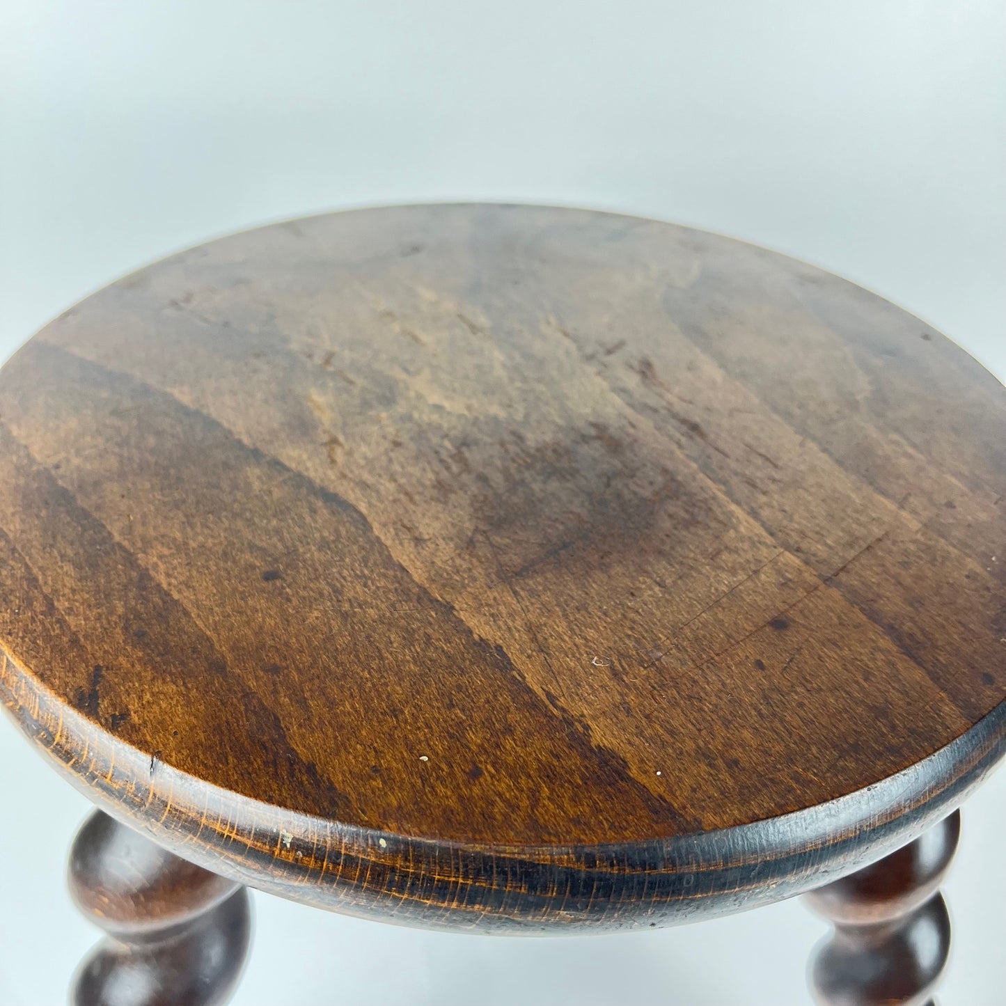 Antique solid wood stool with twisted legs, early 20th century