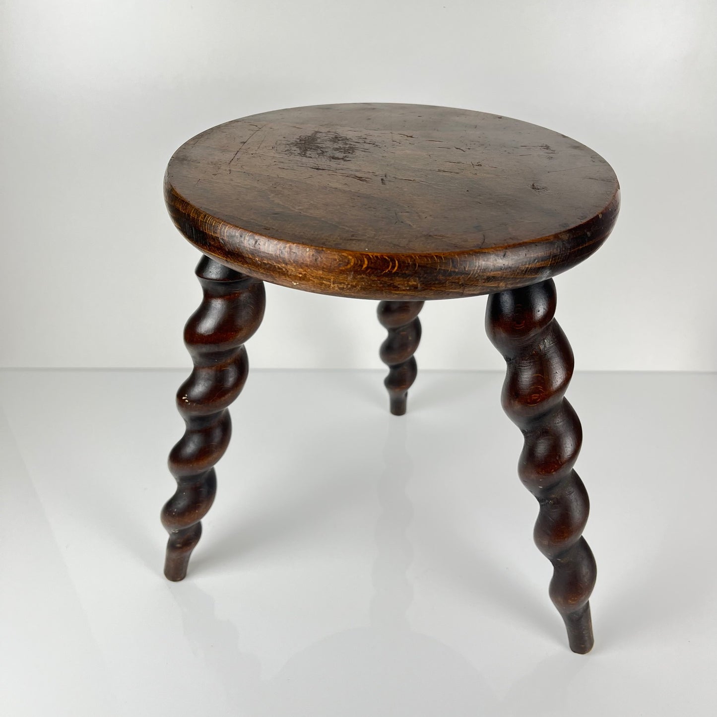 Antique solid wood stool with twisted legs, early 20th century