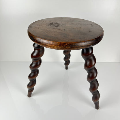 Antique solid wood stool with twisted legs, early 20th century