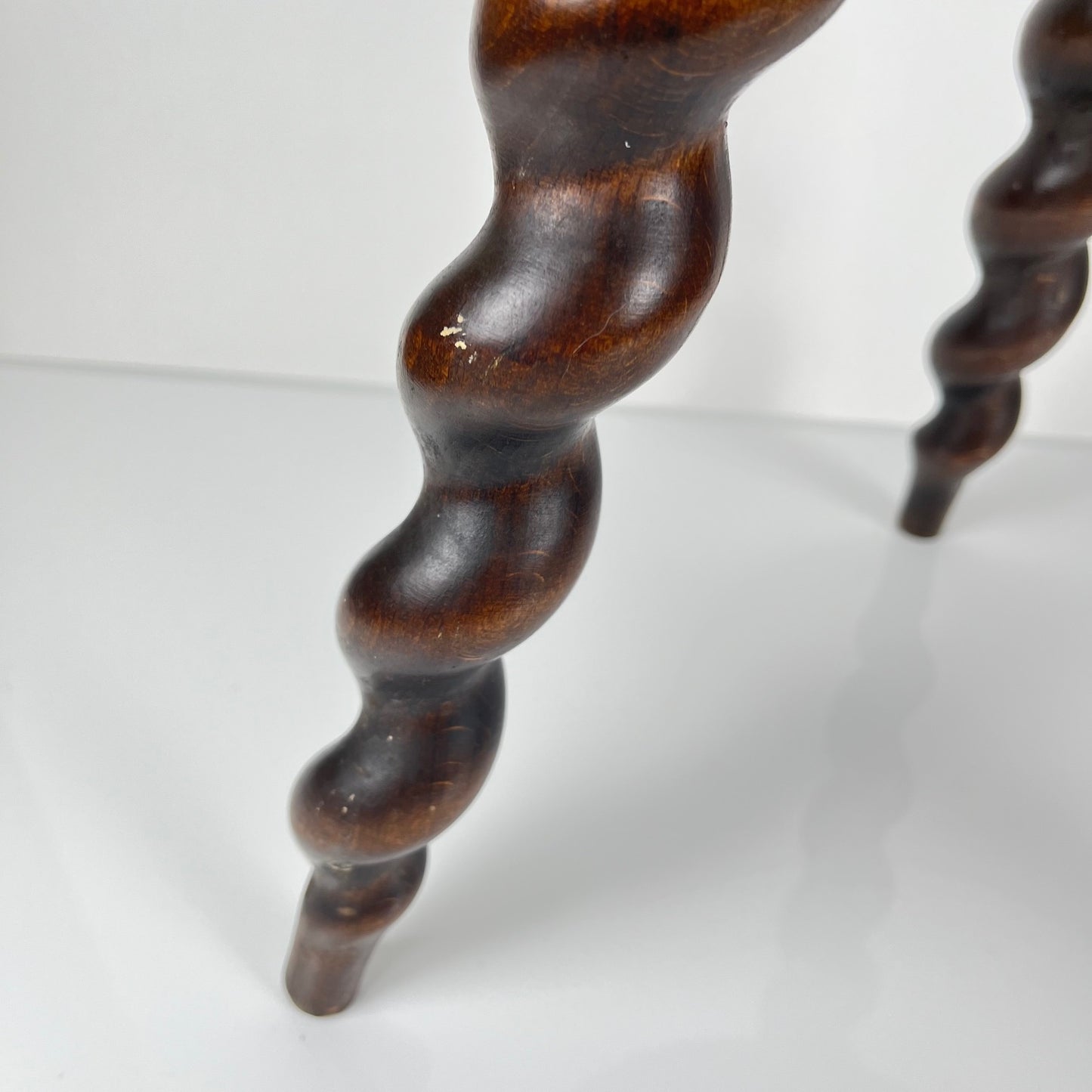 Antique solid wood stool with twisted legs, early 20th century