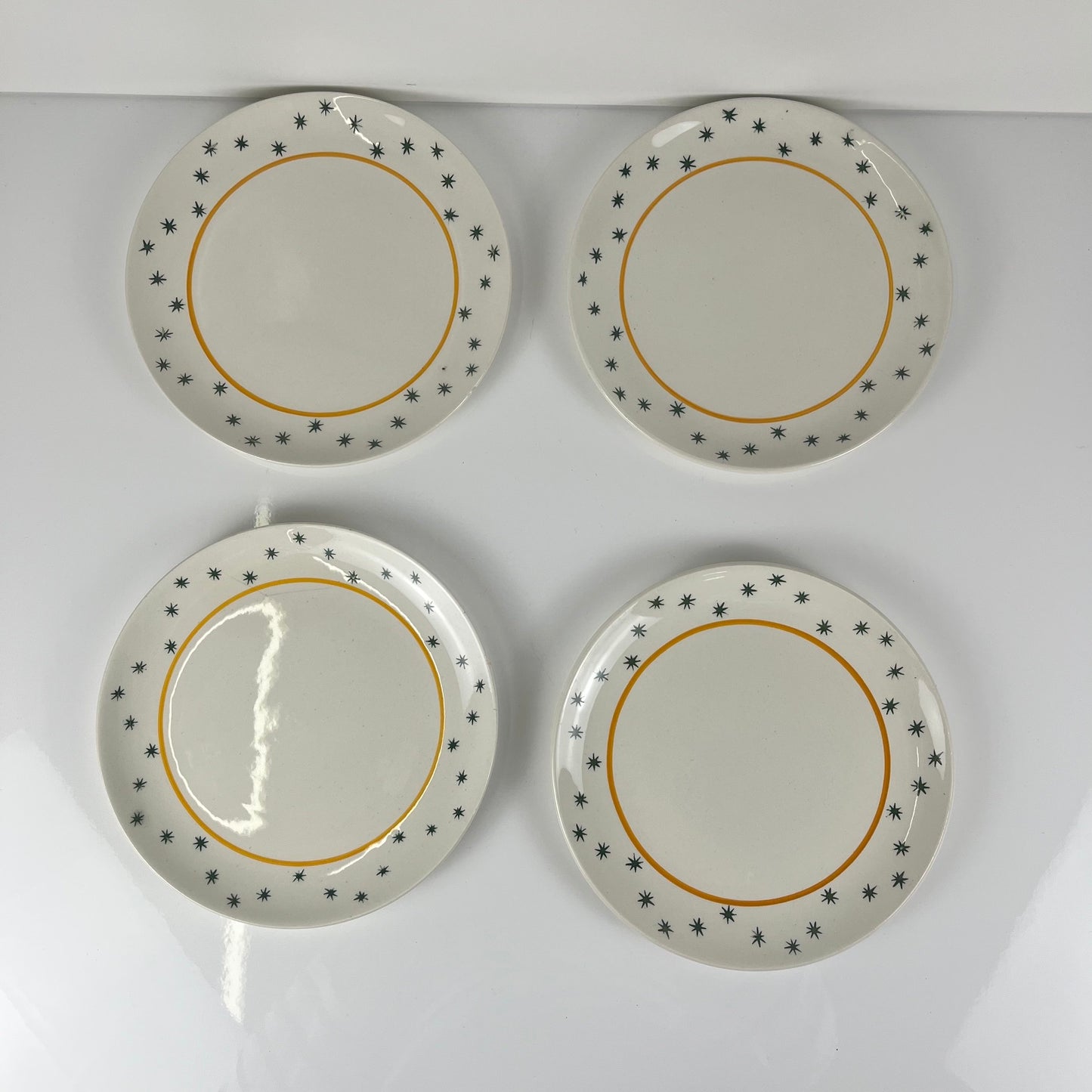 Set de 4 assiettes à dessert GIEN, Création Primefleur, modele "Constellation" , 1950