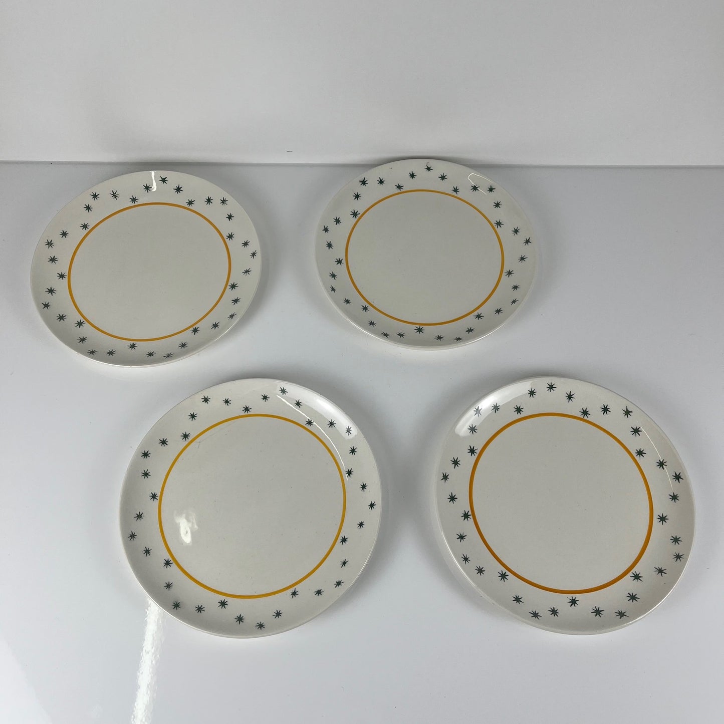 Set de 4 assiettes à dessert GIEN, Création Primefleur, modele "Constellation" , 1950