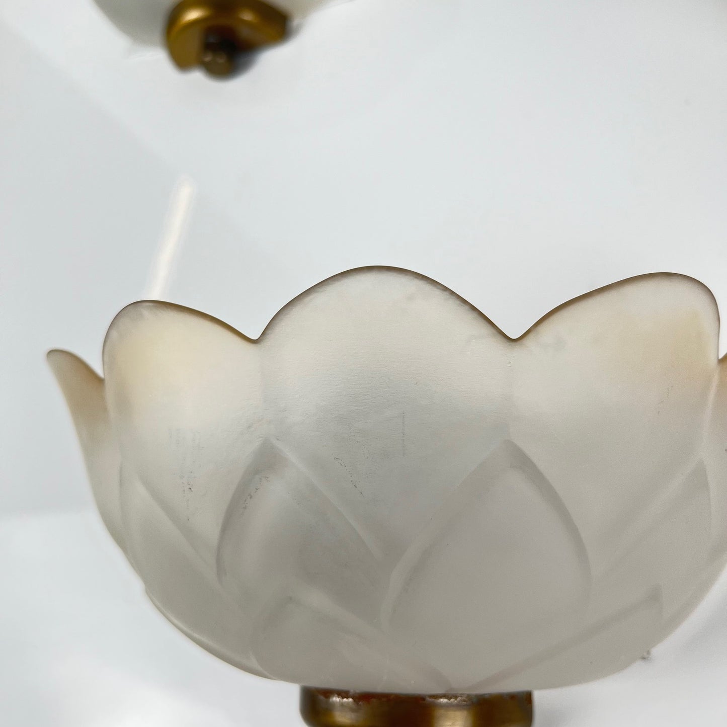 Trio of vintage frosted glass and brass wall sconces