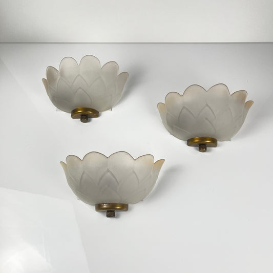 Trio of vintage frosted glass and brass wall sconces