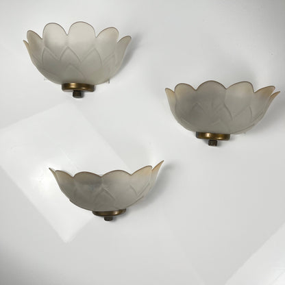 Trio of vintage frosted glass and brass wall sconces