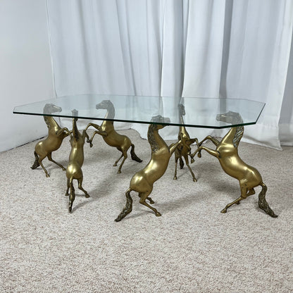 Hollywood Regency style coffee table, 6 patinated brass horses & glass top, 1970