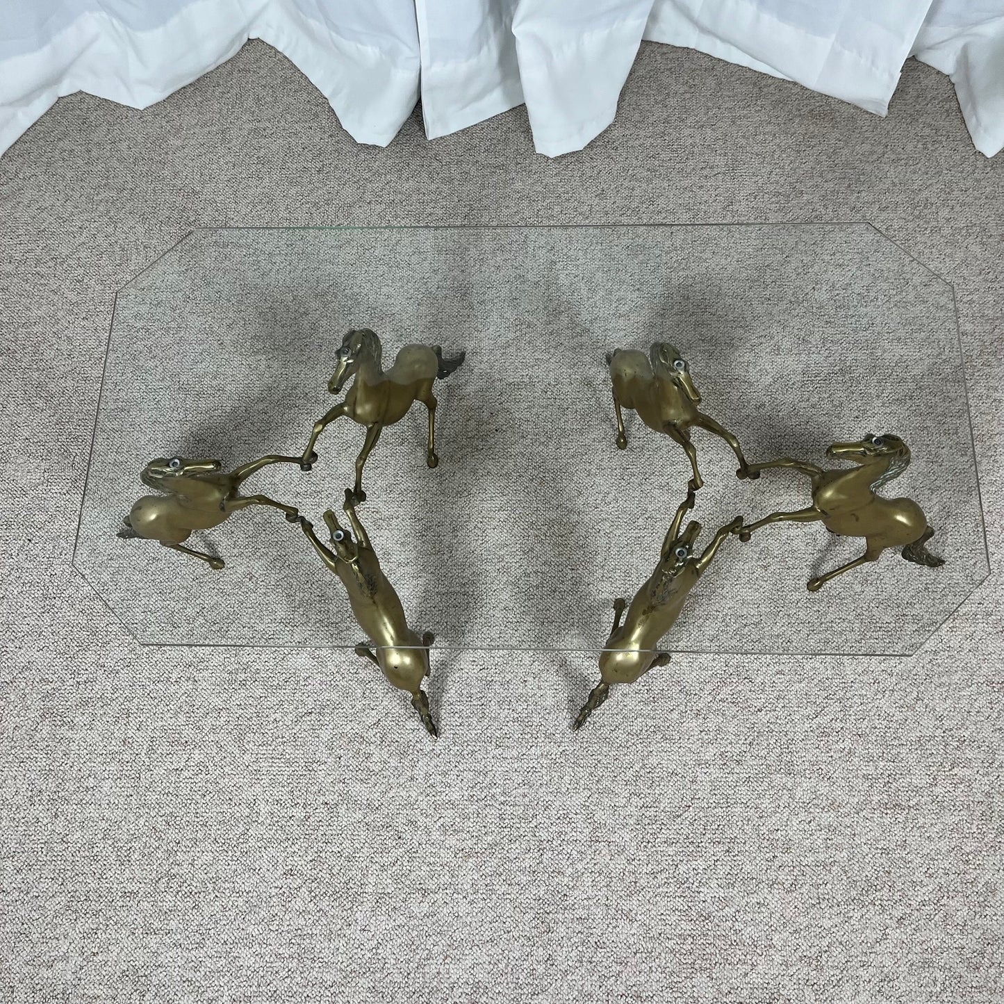 Hollywood Regency style coffee table, 6 patinated brass horses & glass top, 1970