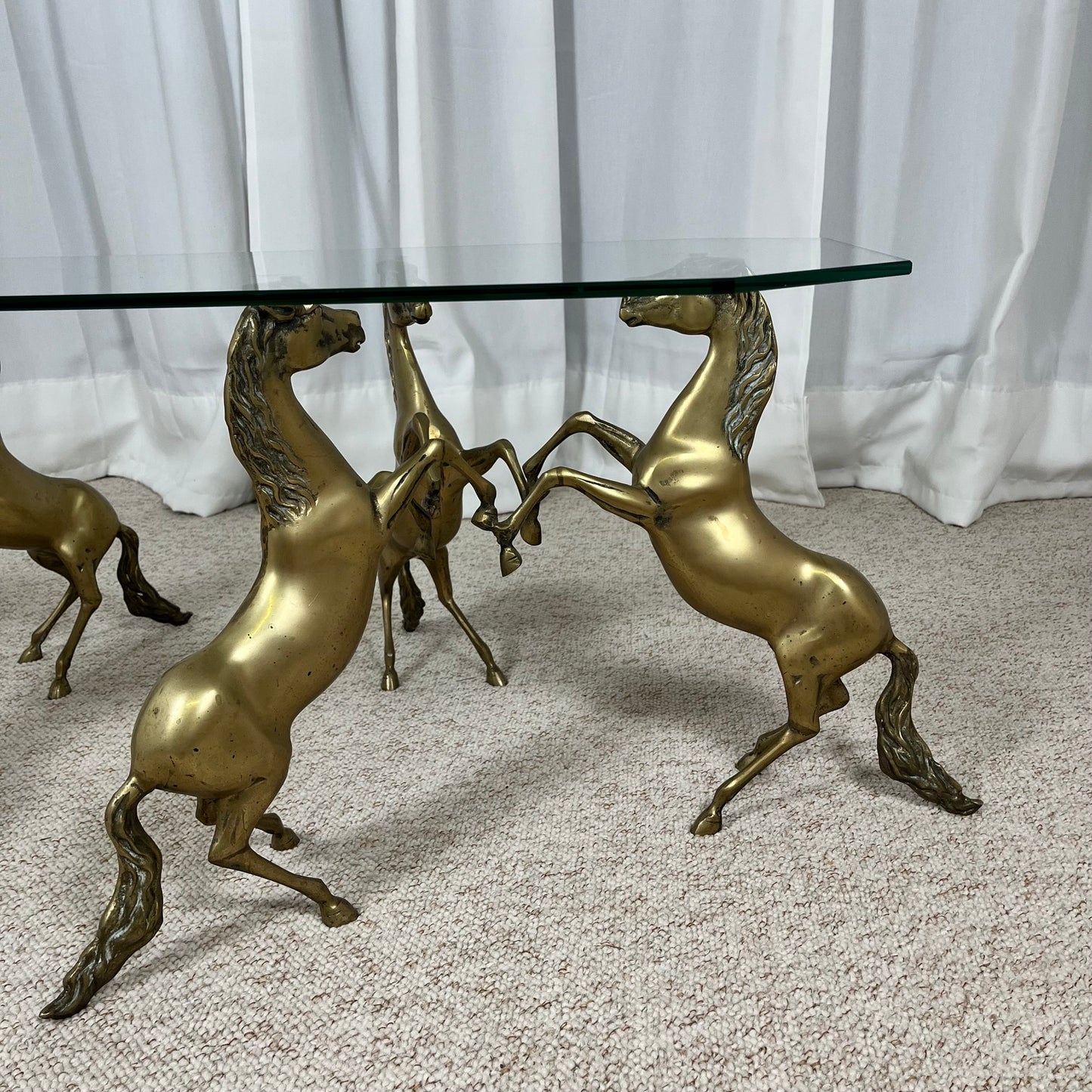 Hollywood Regency style coffee table, 6 patinated brass horses & glass top, 1970