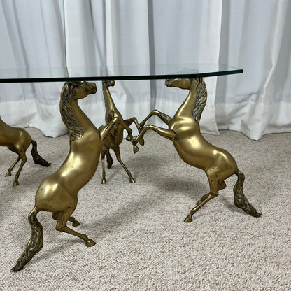 Hollywood Regency style coffee table, 6 patinated brass horses & glass top, 1970