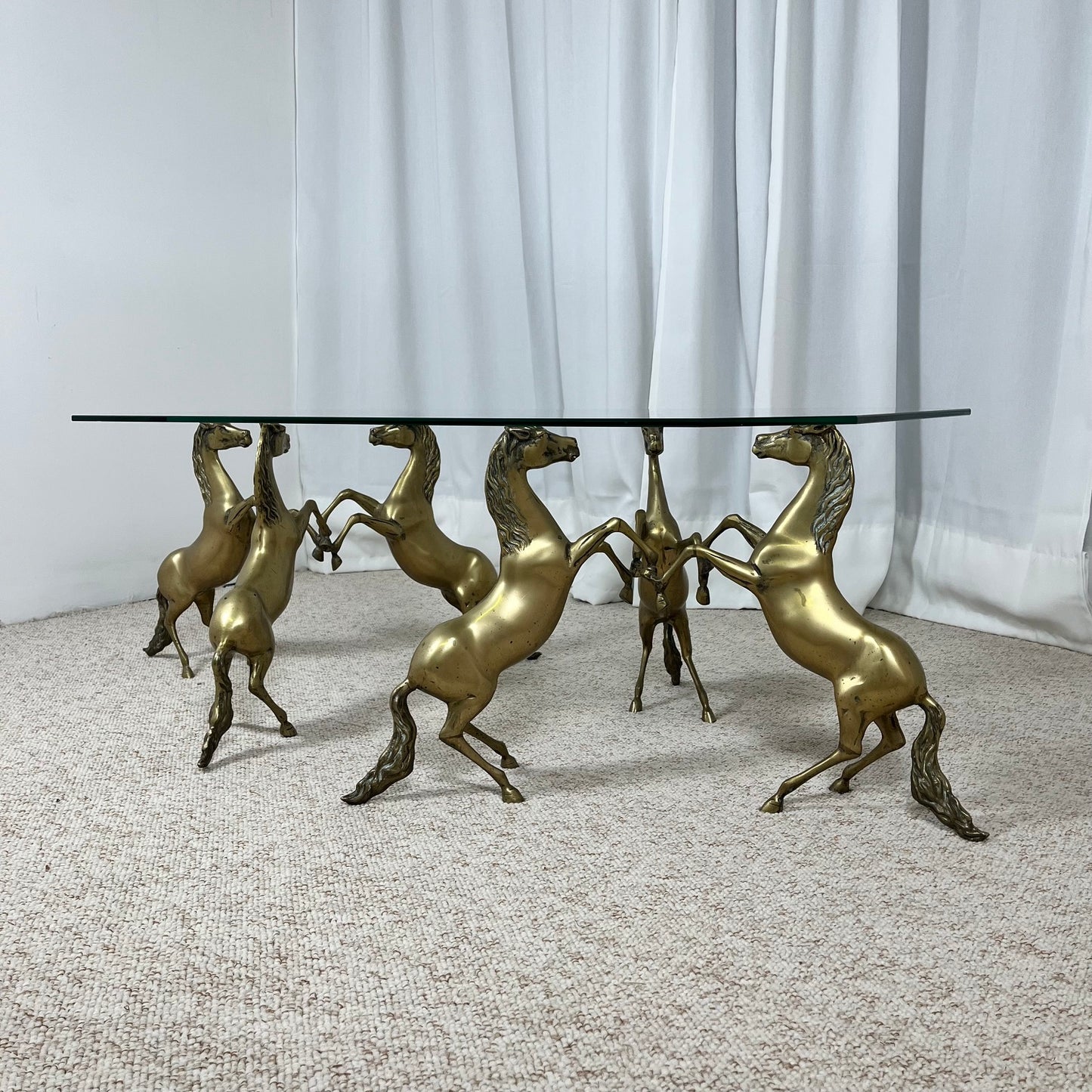 Hollywood Regency style coffee table, 6 patinated brass horses & glass top, 1970