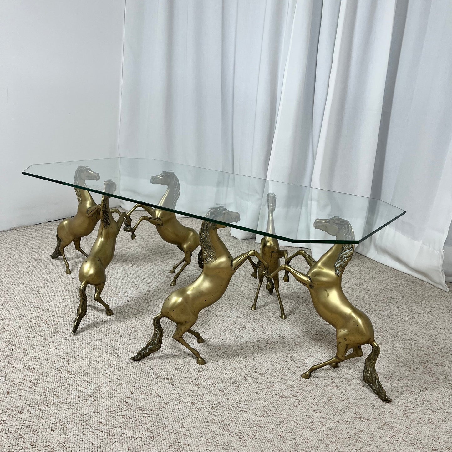 Hollywood Regency style coffee table, 6 patinated brass horses & glass top, 1970