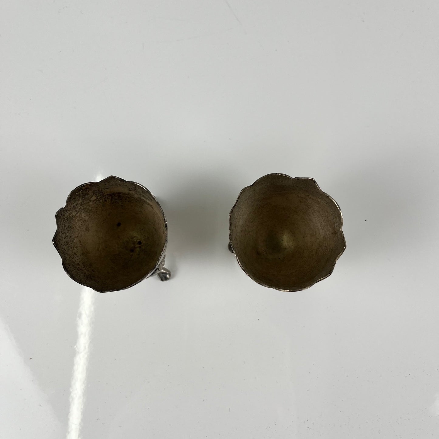 Pair of antique tripod egg cups in nickel silver, Art Nouveau style, circa 1900-1925