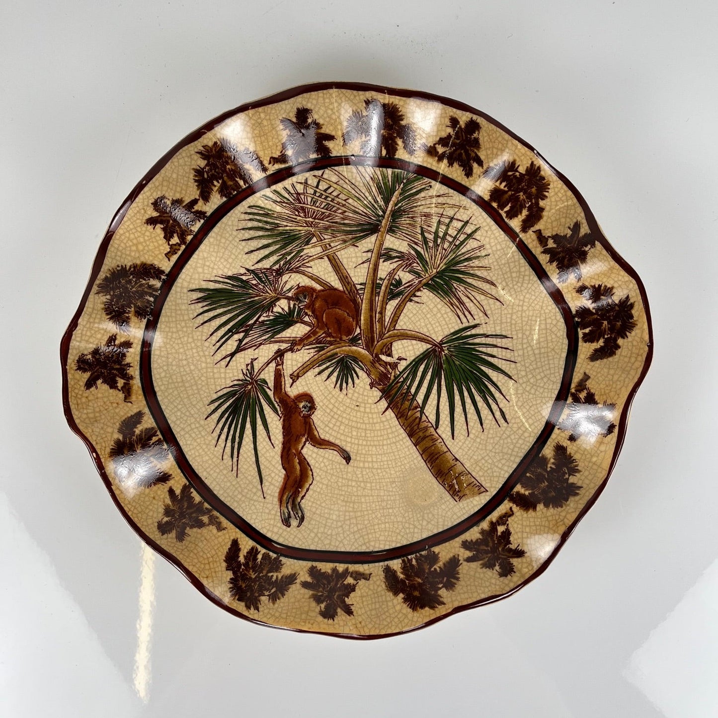 Crackleware plate with an exotic motif of monkeys and palm trees, First half of the 20th century.