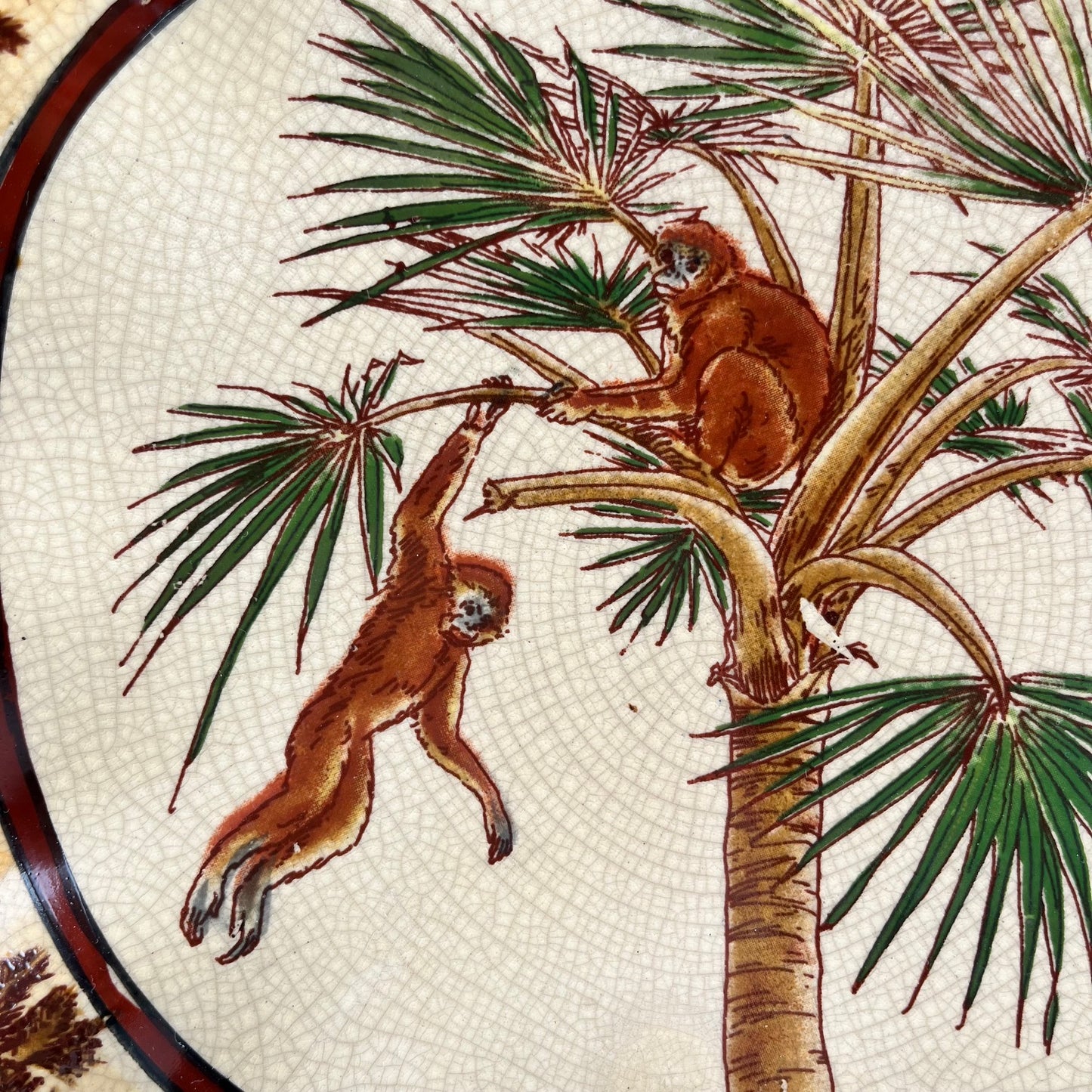 Crackleware plate with an exotic motif of monkeys and palm trees, First half of the 20th century.