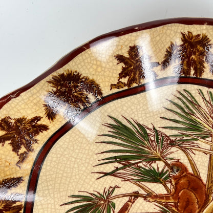 Crackleware plate with an exotic motif of monkeys and palm trees, First half of the 20th century.