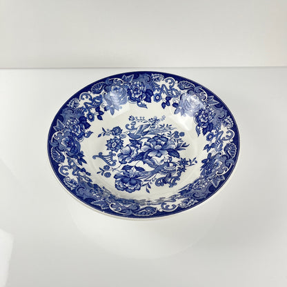 Saladier en faïence bleue, décor floral et oiseaux, début XXe