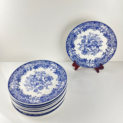 Set of 8 blue earthenware dinner plates with floral and bird decoration, early 20th century