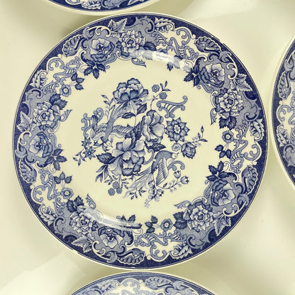 Set of 8 blue earthenware dinner plates with floral and bird decoration, early 20th century