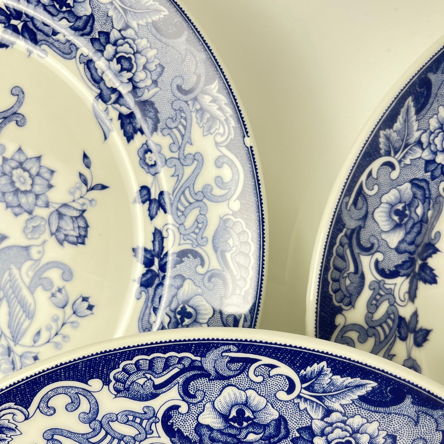 Set of 8 blue earthenware dinner plates with floral and bird decoration, early 20th century