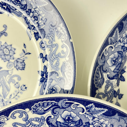 Set of 8 blue earthenware dinner plates with floral and bird decoration, early 20th century