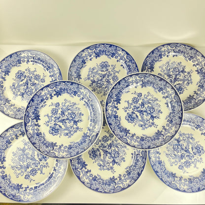 Set of 8 blue earthenware dinner plates with floral and bird decoration, early 20th century