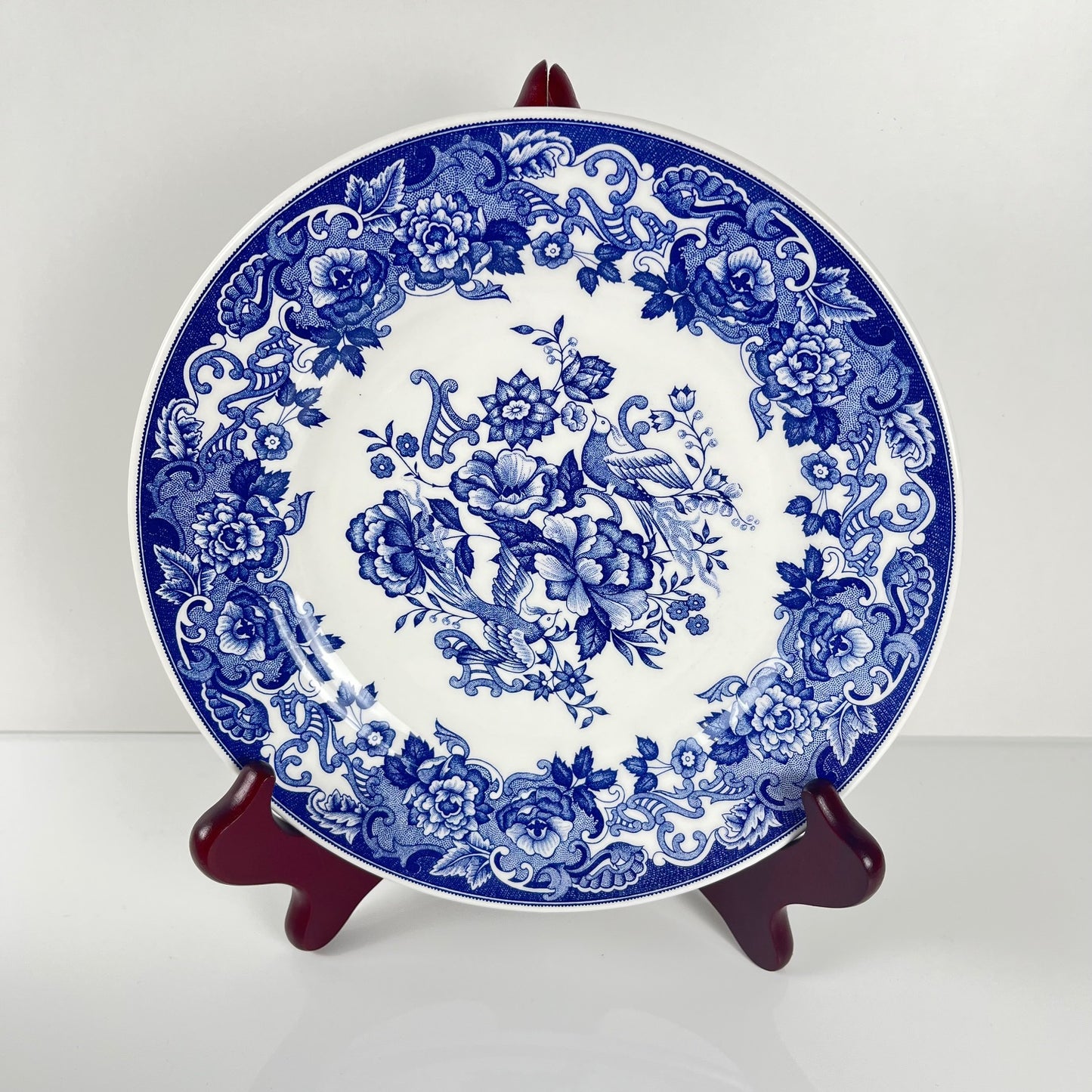 Set of 10 blue earthenware dessert plates with floral and bird decoration, early 20th century