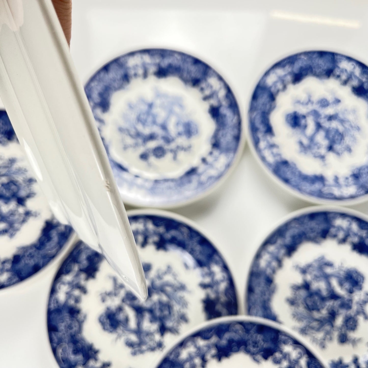 Set of 10 blue earthenware dessert plates with floral and bird decoration, early 20th century