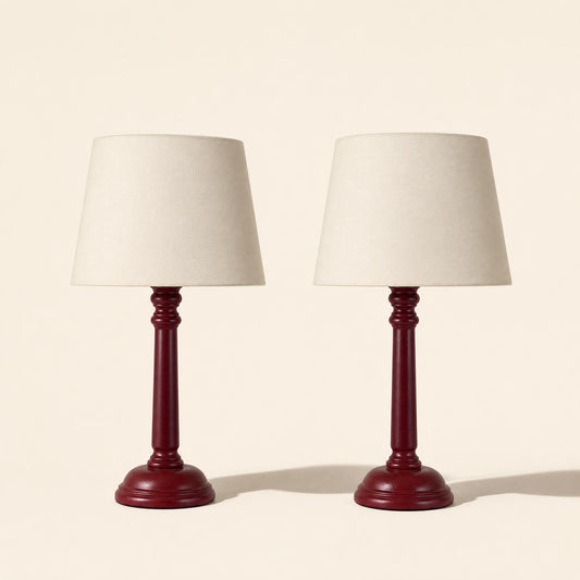 Duo of burgundy-colored wooden bedside lamps